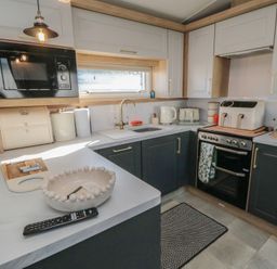A kitchen with appliances and cabinets at 19 Finch