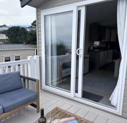 An outdoor seating area with a sofa and table at Club Sahara, Sandy Bay, Exmouth