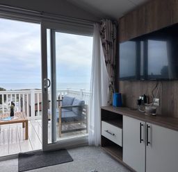 A living room with a view of the sea at Club Sahara Sandy Bay, Exmouth