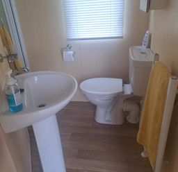 A bathroom with sink and toilet at Chapel Farm Holiday Park No 6 Bunnies View in Appleby-in-Westmorland