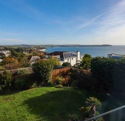 A garden overlooking the ocean and houses at Harber Rise in Carlyon Bay
