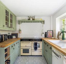 A kitchen with appliances and wooden countertops at the property