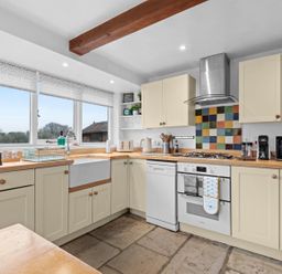 A kitchen with sink, oven, and dishwasher at The Old Barn in Manchester
