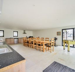 A kitchen with dining table and foosball table at Yurt, Sleeps 5 and Dogs Welcome