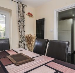 A dining room featuring a table and chairs at 19 Hailey Road