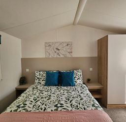 A bedroom with a bed and nightstand at The Old Barn in Manchester