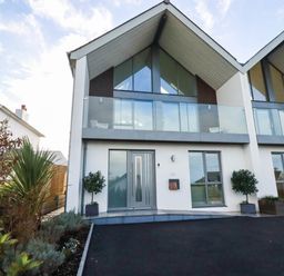 A house with a front entrance and balcony at 1 Endellion View Wadebridge