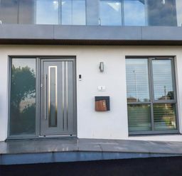A front entrance with a door, window, and mailbox at 1 Endellion View Wadebridge