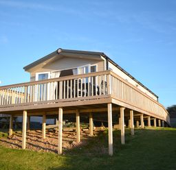 A holiday home with decking and outdoor seating at Perran Sands Holiday Park - 621 Chy-an-Mor Perranporth