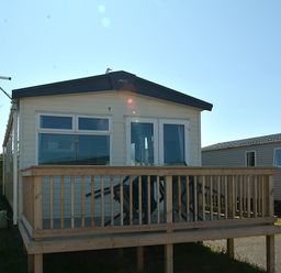 A holiday home with a wooden deck at Perran Sands Holiday Park - 725 Kernow View Perranporth