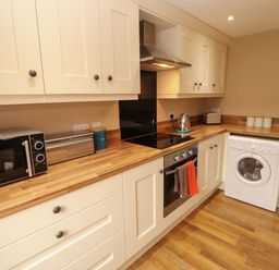 A kitchen with appliances on a countertop at The Old Bothy Bolton Low Houses near Wigton