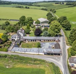 A farmhouse and surrounding fields at Corner Barn in Winterborne Stickland
