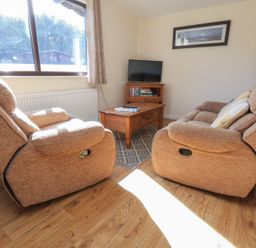 A living room with recliners and a coffee table at Bluebell Lodge in Saltburn-by-the-Sea