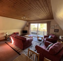 A living room with sofas and a coffee table at Suil Na Mara in Aultbea
