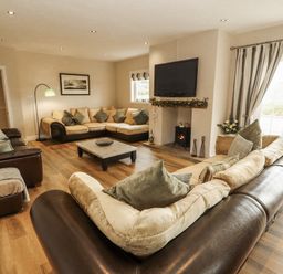 A living room with sofas and a coffee table at White Gables near Cockermouth