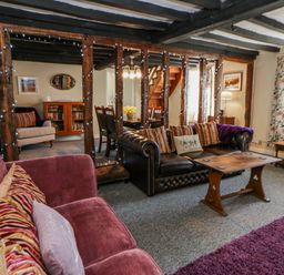 A living room with a sofa and coffee table at Penlone Cottage Rhayader