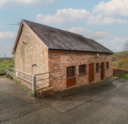 A brick building with windows and doors at Bwthyn-y-Rhiw Penybanc near Llandeilo