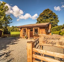 A cabin with sign at Sycamore Lodge Nantmel near Rhayader