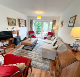 A living room with a television and a coffee table at 38 Dale End, Brancaster Staithe near Burnham Market