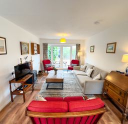 A living room with a sofa and armchairs at 38 Dale End Brancaster Staithe near Burnham Market