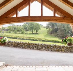 An outdoor area with a view of grass and trees at Ty Gwyn in Llangwm near Bala