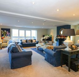 A living room with sofas and a coffee table at Nant-yr-Rhedyn in Red Wharf Bay