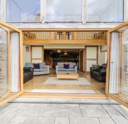 A living room with sofas and a coffee table at The Hayloft Bleddfa near Knighton