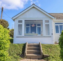 A house with steps leading to the entrance at Highdown in Bigbury on Sea near Modbury