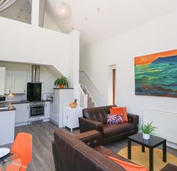 A living room with a sofa and coffee table at Shepherd Oak in Upwey near Weymouth