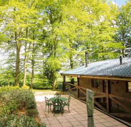 An outdoor seating area with table and chairs at Valley View Lodge Welshpool
