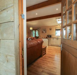 A view of a living room and kitchen area from the entrance at Valley View Lodge in Welshpool