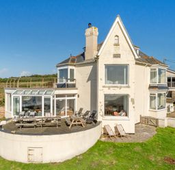 A house with a deck and yard at Carn Eve Sennen Cove near St Just