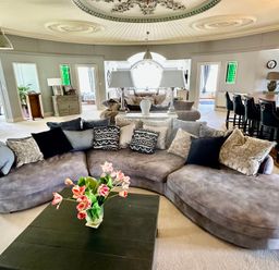 A living room with a sectional sofa and coffee table at Capel Mawr Llanrug near Llanberis