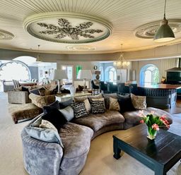A living room with a sofa and coffee table at Capel Mawr Llanrug near Llanberis
