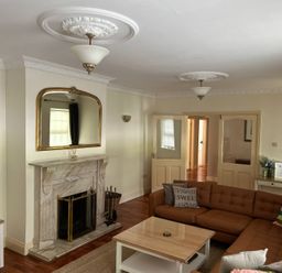 A living room with a sofa and a television at The Sanctuary in Killavullen near Mallow