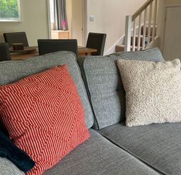 A sofa with cushions in a living room at Lodge 22, Bodmin Holiday Park, Cornwall