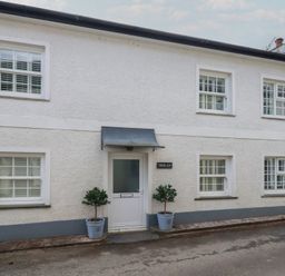 A house exterior with a door and windows at Trelan in Mevagissey