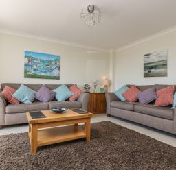A living room with two sofas and a wooden coffee table at Hagar Vor in Marazion