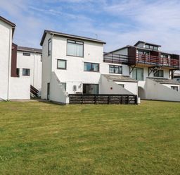 A building with balconies and stairs at Beach House (Ty Traeth) Deganwy