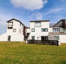 A building with multiple windows and balconies at Beach House (Ty Traeth) in Deganwy