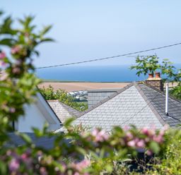 A view of rooftops and the sea at Easterly Cottage in Bude