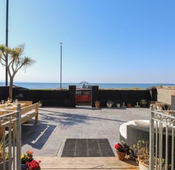 An outdoor area with a view of the ocean at Wavecrest in Pwllheli