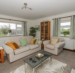 A living room with a sofa and armchairs at Blaenywawr near Lampeter