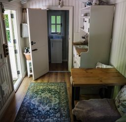 A kitchen with a table and chairs at The Snug in Longtown