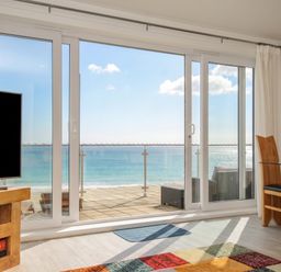 A living room with a view of the ocean at The View in Newquay