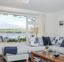 A living room with a sofa and coffee table at Clamoak Cottage Clamoak near Bere Alston
