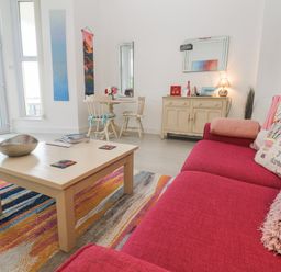 A living room with a coffee table and sofa at Beachcomber in Marazion