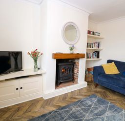 A living room with a television and fireplace at Springfield in Hempton near Fakenham