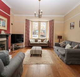 A living room with a sofa and coffee table at Tilly's Retreat in Hunstanton