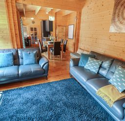 A living room with sofas and a dining area at Tythe Lodge – Hot Tub Retreat in Rural Lincolnshire | Family-Friendly Lodge Near Heckington